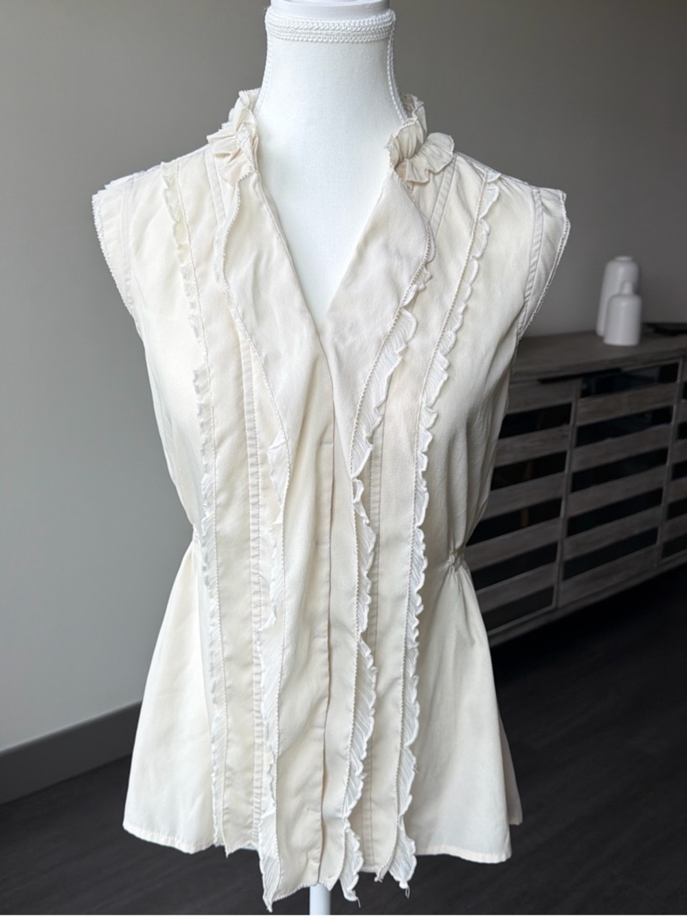 Converse Cream Ruffle-Front Sleeveless Blouse
